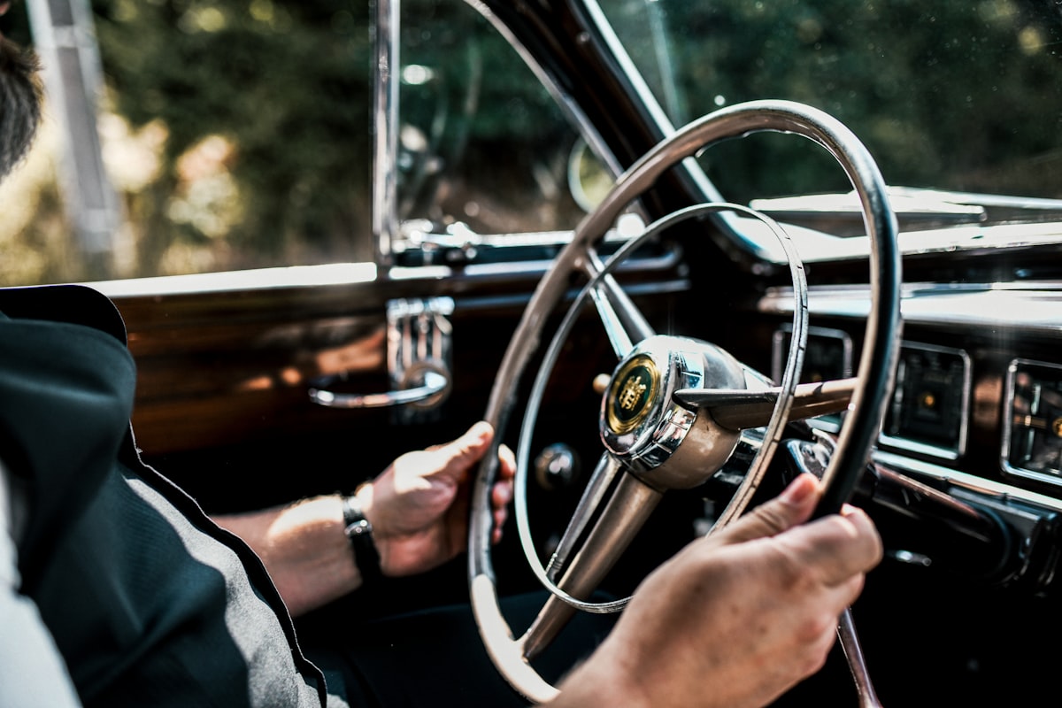 Driver safely holding a steering wheel
